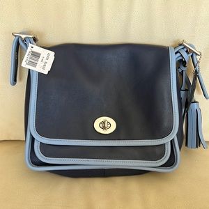 Never been used two tone blue cross body coach bag. Tag still attached